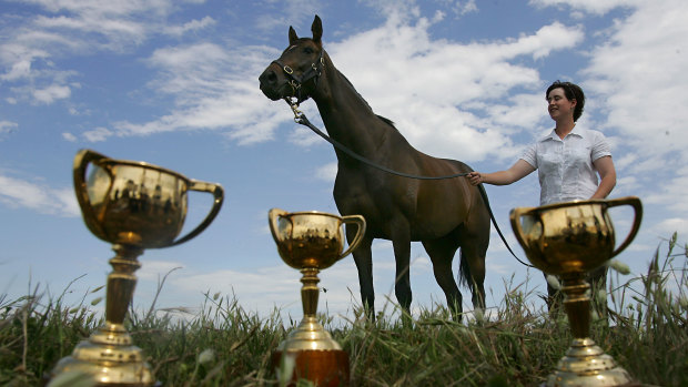 Makybe Diva with strapper, Christine Mitchell, and her three Melbourne Cups.