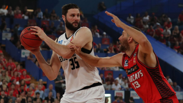 United's Alex Pledger and Tom Jervis of the Wildcats in action during game one of the NBL grand final series in Perth.