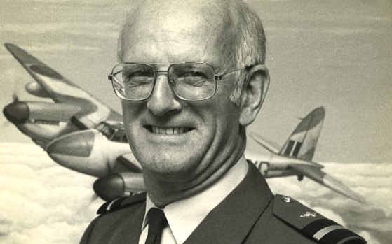 Air Commodore Bob Wade  in front of a Mosquito aircraft.