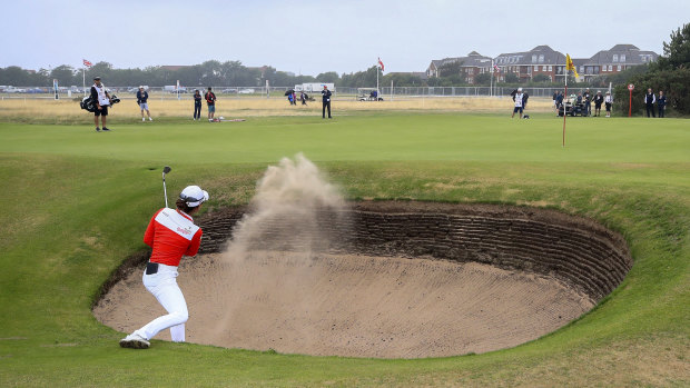 Australia's Minjee Lee chips out of a bunker, and is still in the hunt.