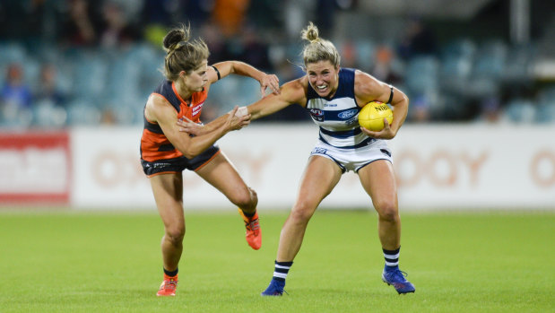 Ellie Brush pressures Melissa Hickey of the Cats.