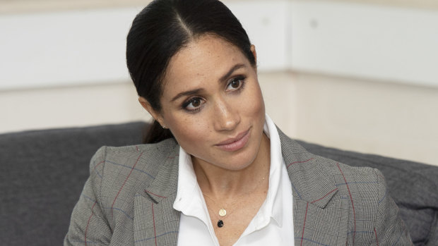 Meghan Markle wearing Natalie Marie initial necklace while in Australia in October 2018.
