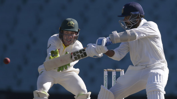 Consolation runs: Murali Vijay takes the to Cricket Australia XI attack late in the day.