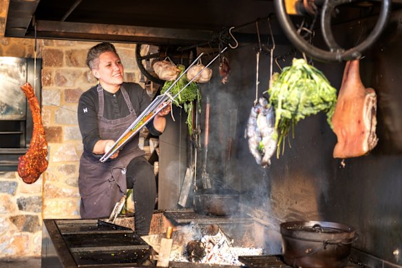 Chef Nicola Palmer of SA’s Watervale Hotel prepping produce for the pub’s wood-fired oven.