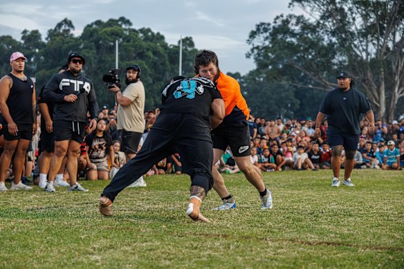 Andrew Alauni (black shirt) competes at a Run It Straight event.