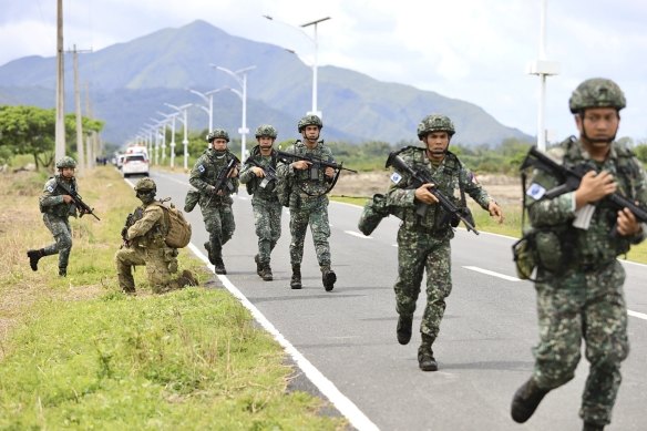 Australian and Filipino Forces participate in a large-scale combined amphibious assault exercise at a naval base in San Antonio, Zambales, Philippines, on Friday.