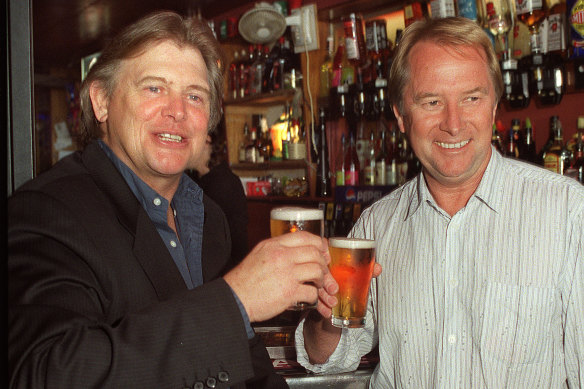   John Farnham and Glenn Wheatley toasting a beer to the success of the latest tour, 2002.