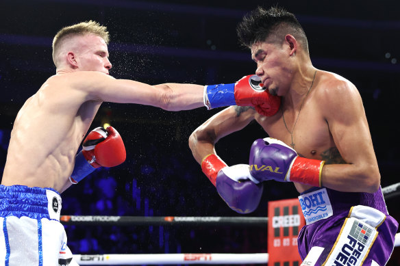 Liam Wilson lands a punch on Emanuel Navarrete.