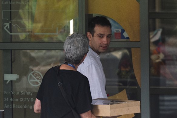 People deliver boxes of food to St Vincent’s Hospital.