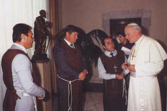 William Kamm meeting Pope John Paul II in the 1980s.