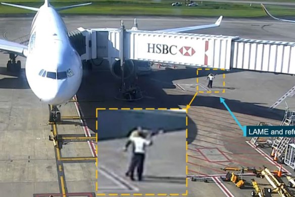 Security footage of the Brisbane Airport refueller, pictured with the  licensed aircraft maintenance engineer (LAME), pointing towards Singapore Airlines flight 256 (out of shot) and informing the engineer the sensor covers were fitted.