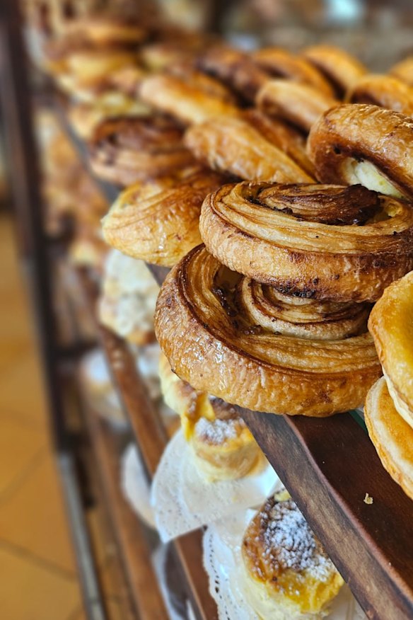 The bakery serves three kinds of pastry snails: cinnamon butter, lemon curd and pistachio.