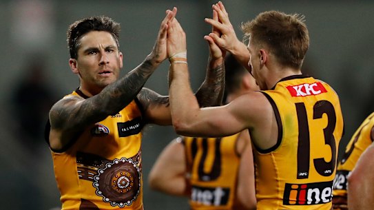 LAUNCESTON, AUSTRALIA - MAY 22: Chad Wingard of the Hawks celebrates with Dylan Moore of the Hawks during the 2022 AFL Round 10 match between the Hawthorn Hawks and the Brisbane Lions at UTAS Stadium on May 22, 2022 in Launceston, Australia. (Photo by Dylan Burns/AFL Photos via Getty Images)