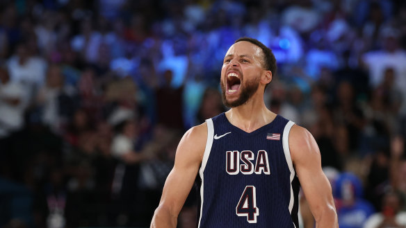Steph Curry roars after nailing a three-point shot.