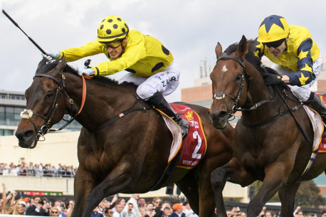 Mark Zahra (left) broke the whip rules when he won the Caulfield Cup on Without A Fight.