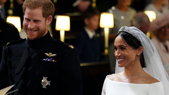 The happy couple: Prince Harry and Meghan Markle grin during the wedding ceremony.