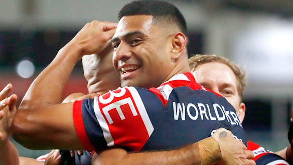 Rooster Daniel Tupou  embraces Blake Ferguson after scoring a try.