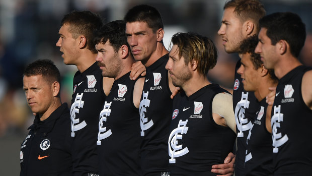 High hopes: Coach Brendon Bolton lines up with his side before the match against Hawthorn at UTAS Stadium in Launceston, Tasmania.