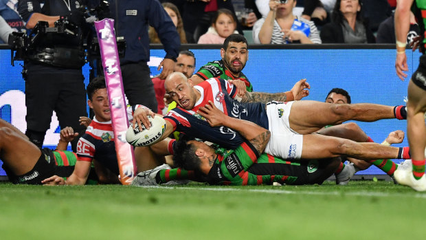 Match-winner: Blake Ferguson dives over in the corner for one of the Roosters' three tries.