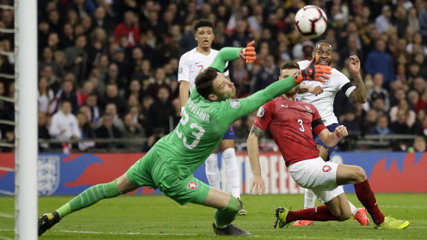 Sterling gets past the keeper to score England's third goal.
