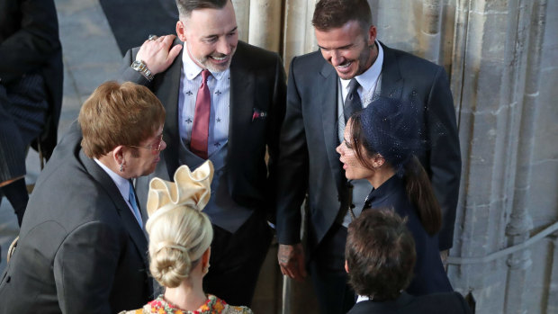 David and Victoria Beckham (right) talk with Sir Elton John and David Furnish,  and Sofia Wellesley and James Blunt as they wait for the service to begin. 
