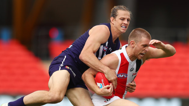 Nat Fyfe lays a tackle during the round six clash with the Saints.