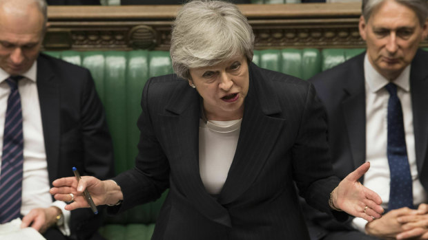 Britain's Prime Minister Theresa May speaks in the House of Commons on Wednesday as moves to oust her intensified.