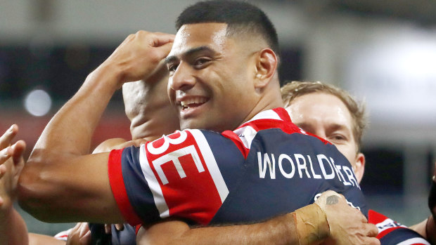 Rooster Daniel Tupou  embraces Blake Ferguson after scoring a try.