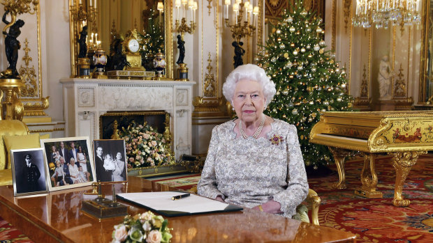 Queen Elizabeth poses for a photograph after recording her annual Christmas Day message, in the White Drawing Room of Buckingham Palace.