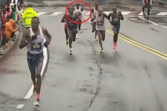 Eliud Kipchoge falls back as Gabriel Geay makes a break at the 30km mark in this year’s Boston marathon.