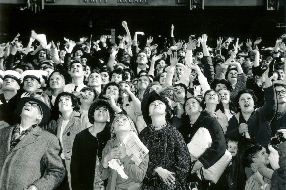 Thousands of fans waiting for the Fab Four to appear on the balcony of Melbourne Town Hall.