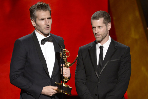David Benioff, left, and Dan Weiss collect an Emmy for Game of Thrones in 2015.