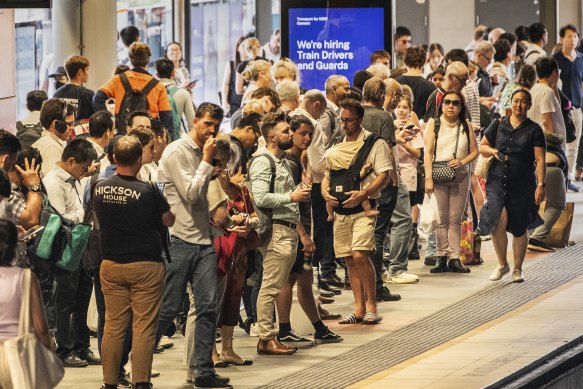 Passengers wait at Chatswood station.
