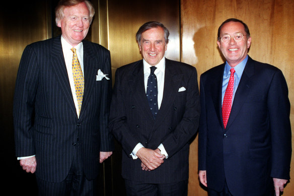 Carnegie is flanked by Ron Walker (left) and Lloyd Williams after a Hudson Conway annual meeting.