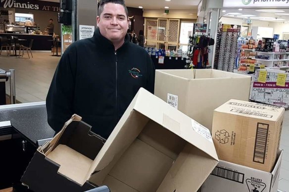 Sam Keeley with some boxes for customers. 