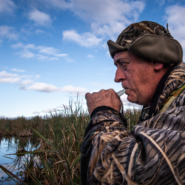 Duck hunter Dave Smeaton using his caller to lure ducks in.