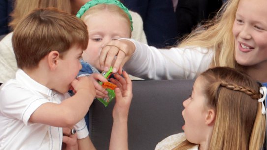 Prince Louis, Princess Charlotte and Savannah Phillips eat sweets, during the Platinum Jubilee Pageant held outside Buckingham Palace, in London.