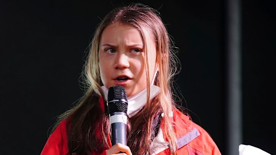 Greta Thunberg addresses protesters outside the climate summit in Glasgow on Friday, local time.