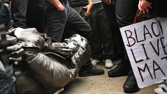 Protesters pull down a statue of slave trader Edward Colston during a Black Lives Matter protest rally in Bristol.