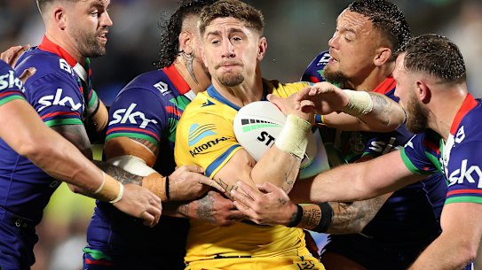 In a bind: Former Eels star Zac Lomax (centre) and Parramatta are heading to court.