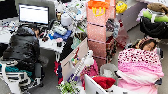 Employees take naps during lunch hour at Tencent in Guangzhou, China