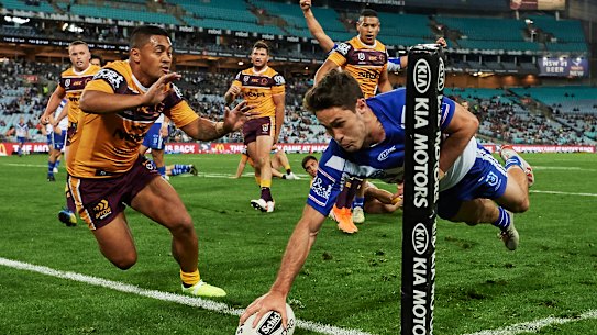 Sideline swerve: Nicholas Meaney of the Bulldogs finds the line untouched. 