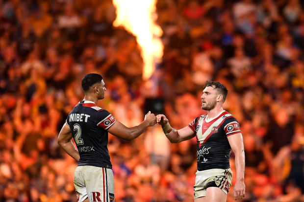 Daniel Tupou and Angus Crichton share a moment on the field during Magic Round in Brisbane.