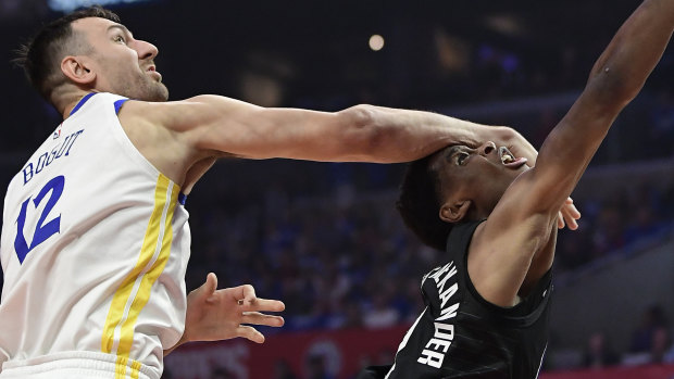 Golden State's Andrew Bogut (left) takes on the Clippers' Shai Gilgeous-Alexander in game four.