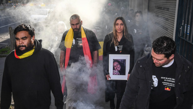 Tanya Day's family and supporters take part in a smoking ceremony ahead of the 2019 inquest into her death.