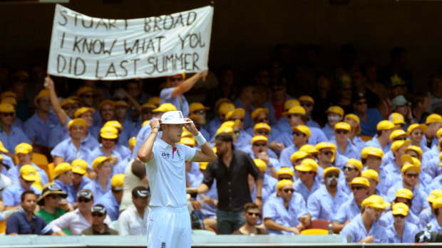Fans at the Gabba make their feelings known as Stuart Broad fields on the boundary in 2013.