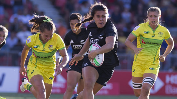 Rampant: Shakira Baker of New Zealand brushes off the defence to score in the final against Australia.