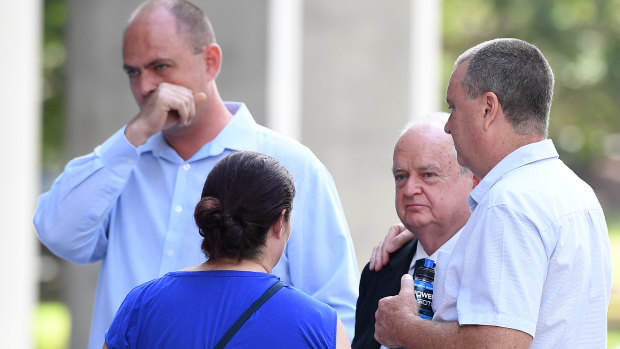 Mark Knowles (right), brother of murder victim Patricia Riggs, and her father, Jon Knowles (second right) with other family members outside the Supreme Court in Brisbane on Thursday. 