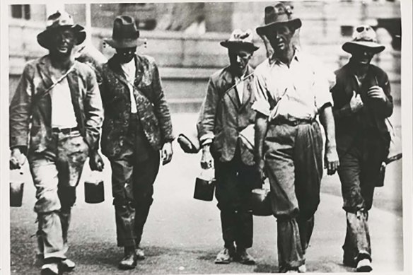 A group of men on the hunt for work during the Great Depression.