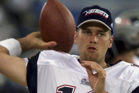 Brady warms up in 2000, when he was the Patriots’ fourth-string quarterback.